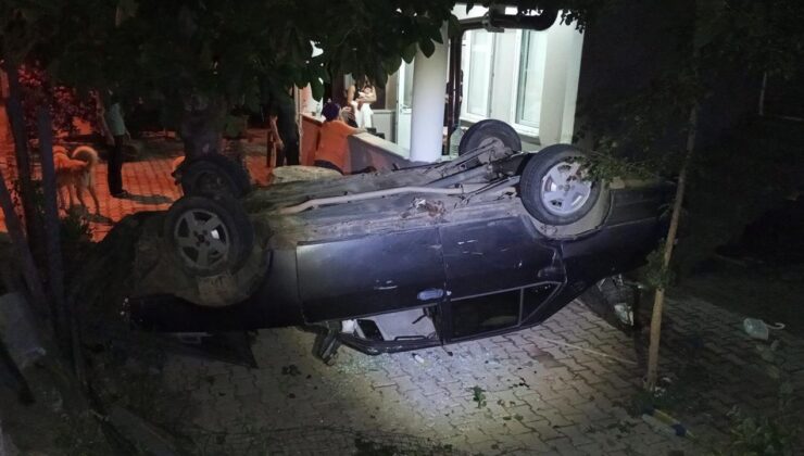 Otomobil takla atarak evin bahçesine devrildi